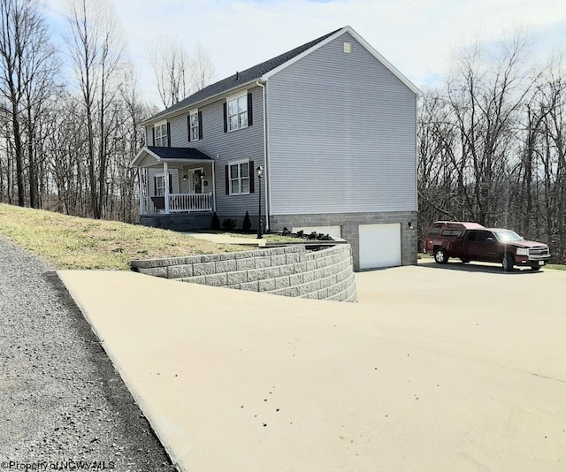 view of side of property featuring a garage