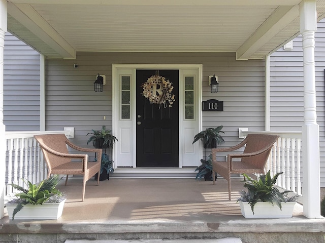 property entrance featuring covered porch