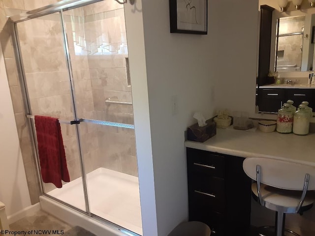 bathroom featuring vanity, toilet, and an enclosed shower