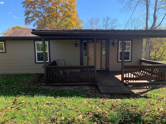 rear view of house with a wooden deck