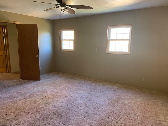 unfurnished bedroom with carpet flooring and ceiling fan