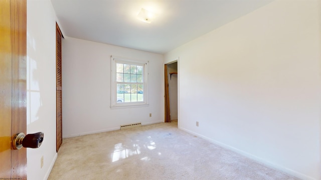 unfurnished bedroom with light carpet