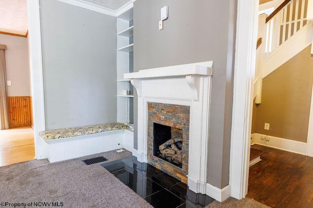 interior space featuring crown molding and dark hardwood / wood-style floors