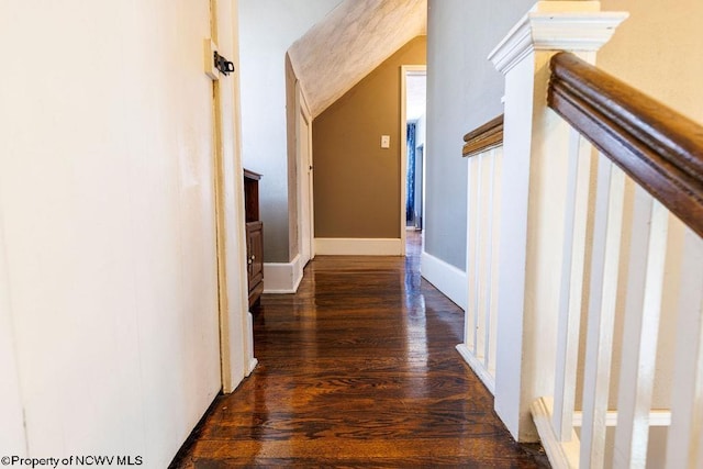 hallway with dark hardwood / wood-style flooring