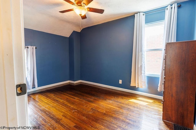 unfurnished room featuring ceiling fan, wood-type flooring, and vaulted ceiling