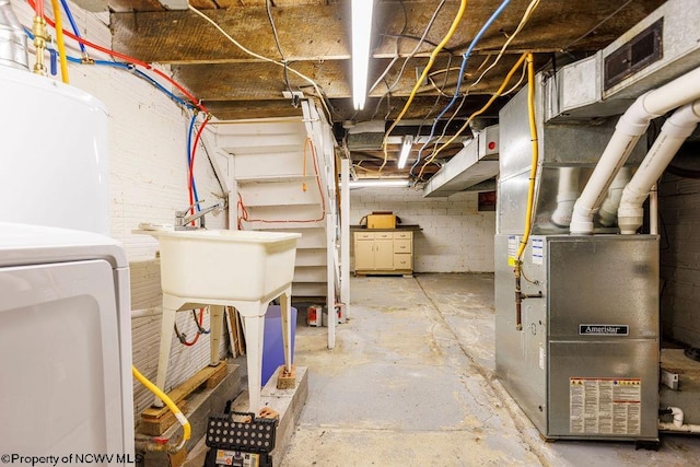 basement with washer / dryer and heating unit