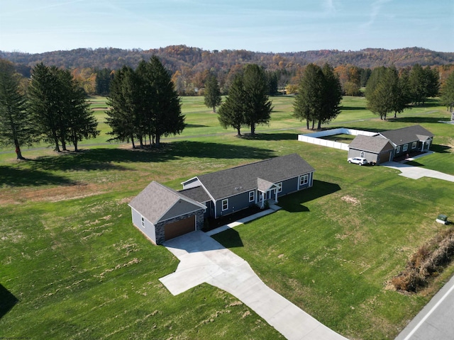 aerial view featuring a wooded view