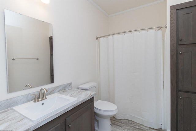 bathroom with hardwood / wood-style floors, toilet, ornamental molding, vanity, and curtained shower