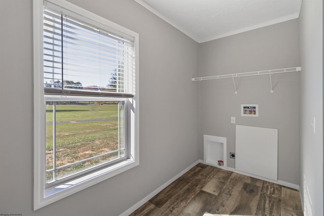 clothes washing area with hookup for an electric dryer, hookup for a washing machine, ornamental molding, and dark wood-type flooring