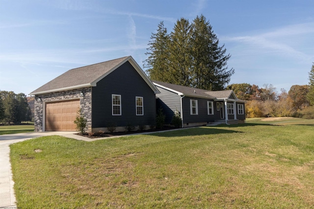 single story home with a front yard and a garage