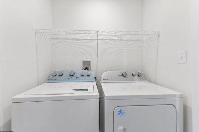 laundry area with washer and clothes dryer