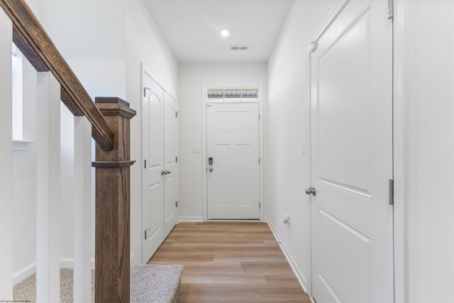 entryway with light hardwood / wood-style floors