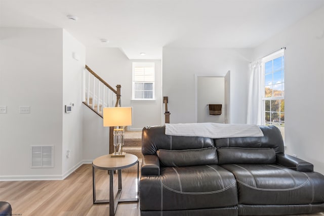 bedroom featuring light hardwood / wood-style floors and multiple windows