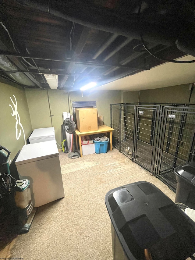 basement with carpet and washer and dryer