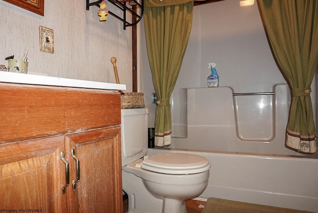 bathroom with shower / bath combination with curtain and toilet