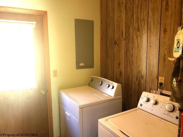 clothes washing area featuring washing machine and dryer and electric panel