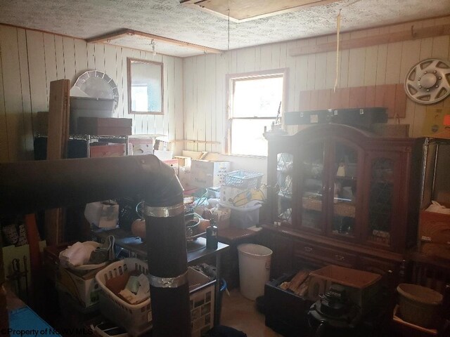 2100 Whitmer Rd, Harman, WV 26270 - dining space with wood walls, a textured ceiling, and healthy amount of natural light