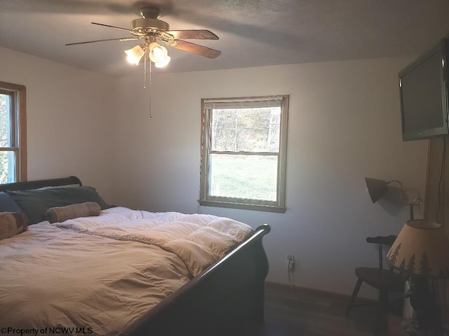 2100 Whitmer Rd, Harman, WV 26270 - bedroom with ceiling fan and wood finished floors