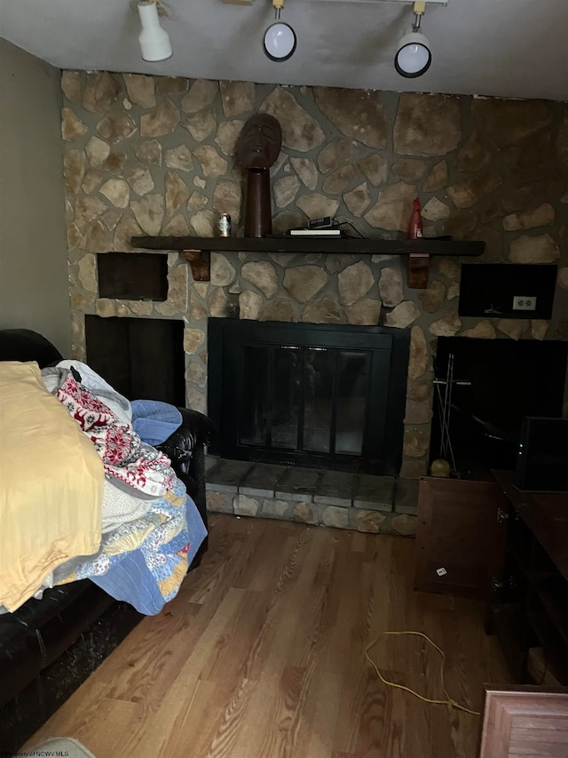 interior details with a fireplace and hardwood / wood-style floors