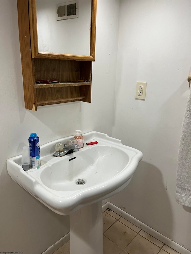 bathroom featuring sink and tile patterned floors