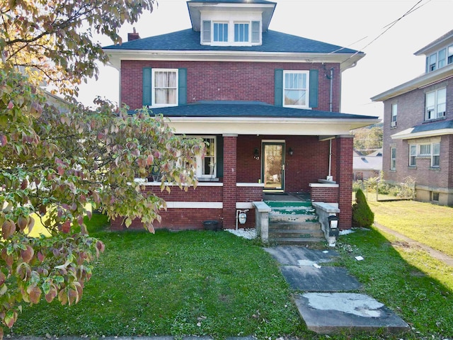 view of front of home featuring a porch and a front lawn