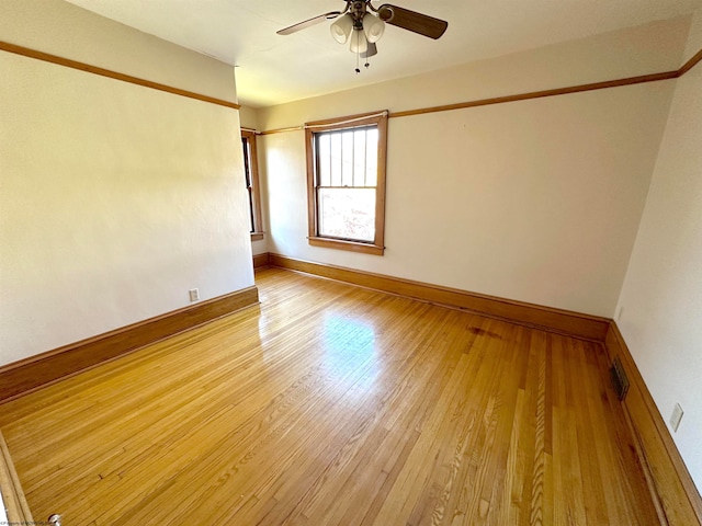 empty room featuring light hardwood / wood-style floors and ceiling fan