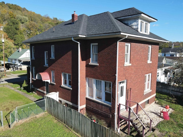 view of home's exterior featuring a lawn