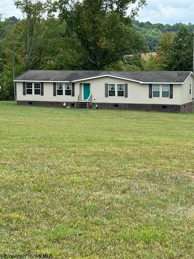 view of front of home with a front yard