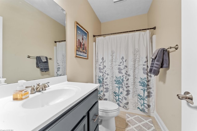 bathroom with vanity, toilet, and tile patterned flooring