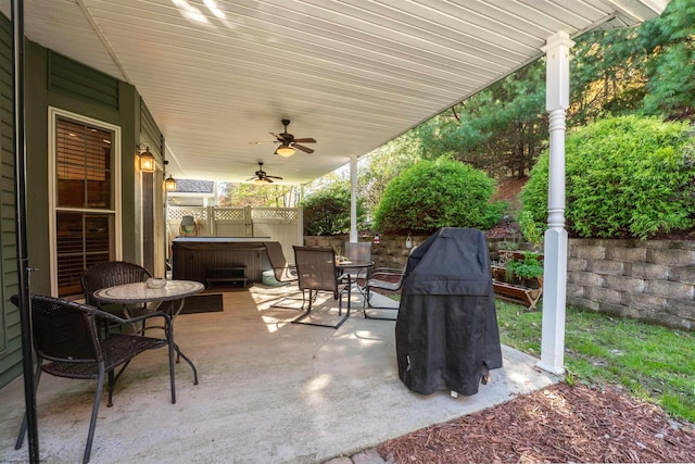 view of patio / terrace featuring a hot tub and ceiling fan