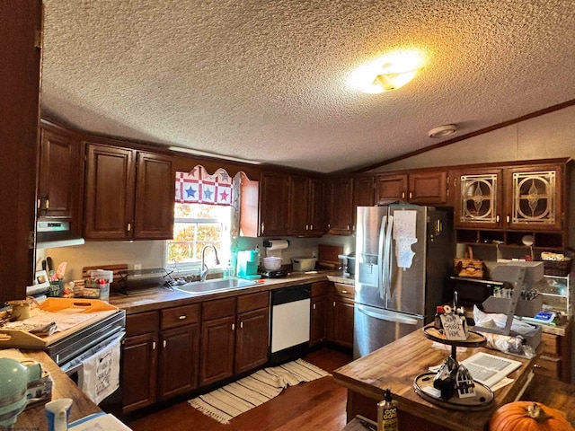 kitchen featuring sink, dishwasher, a textured ceiling, stainless steel fridge, and dark wood-type flooring