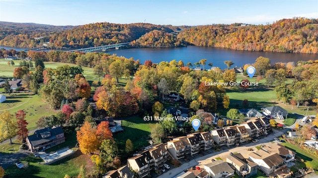 bird's eye view with a wooded view and a water view
