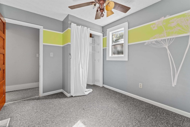 unfurnished bedroom with a closet, ceiling fan, and carpet