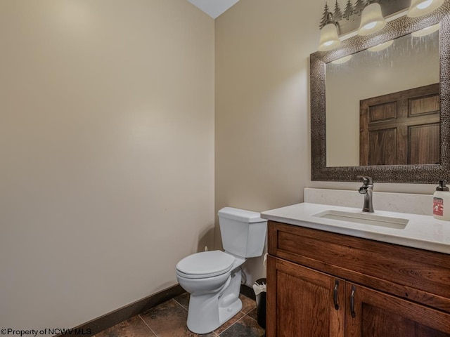 bathroom featuring vanity, toilet, and tile patterned floors