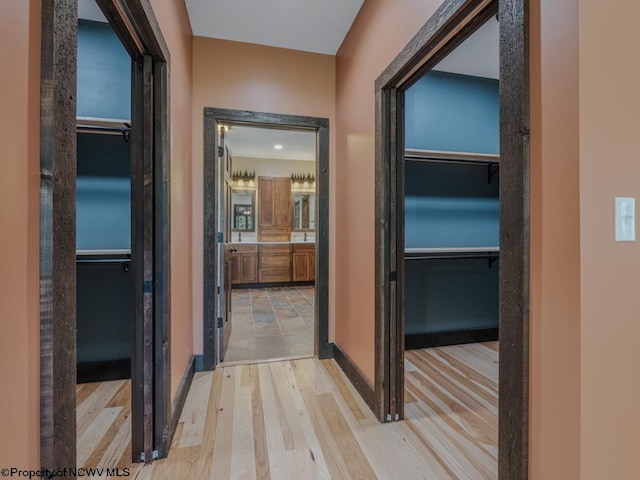 hallway with light wood-type flooring