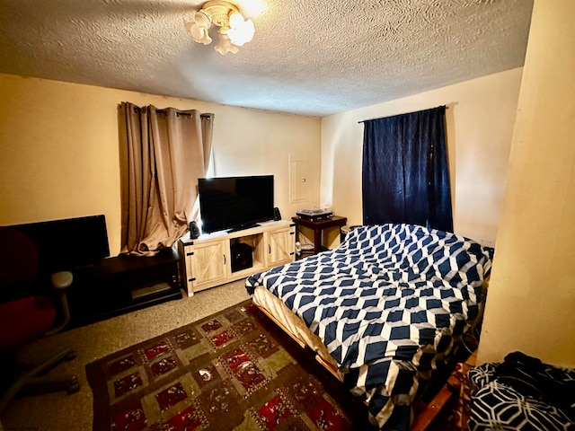 carpeted bedroom with a textured ceiling