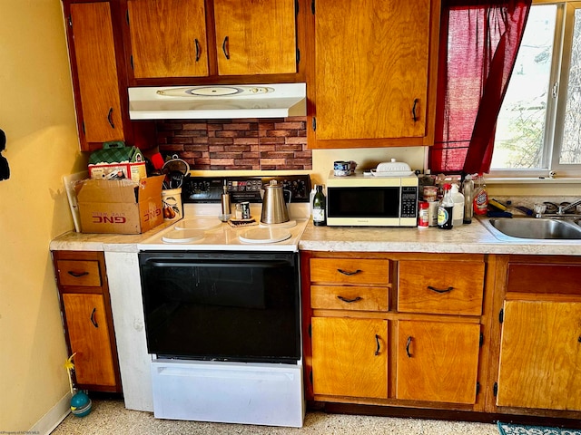 kitchen featuring white electric range and sink