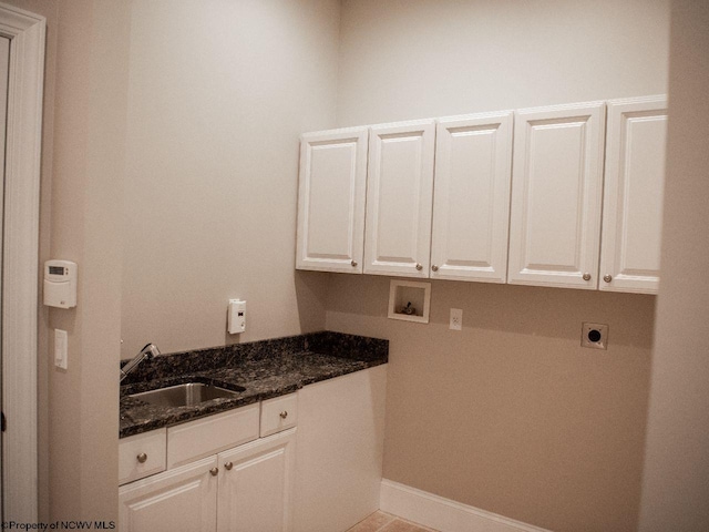 clothes washing area featuring cabinets, washer hookup, light tile patterned flooring, hookup for an electric dryer, and sink