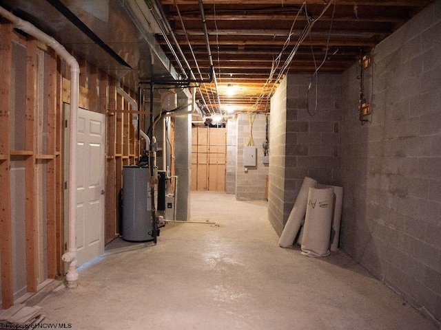 basement featuring gas water heater