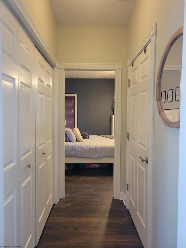 corridor featuring dark hardwood / wood-style floors