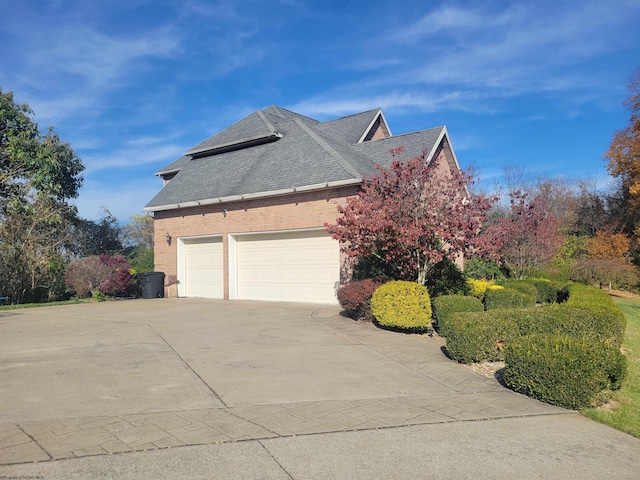 view of property exterior with a garage