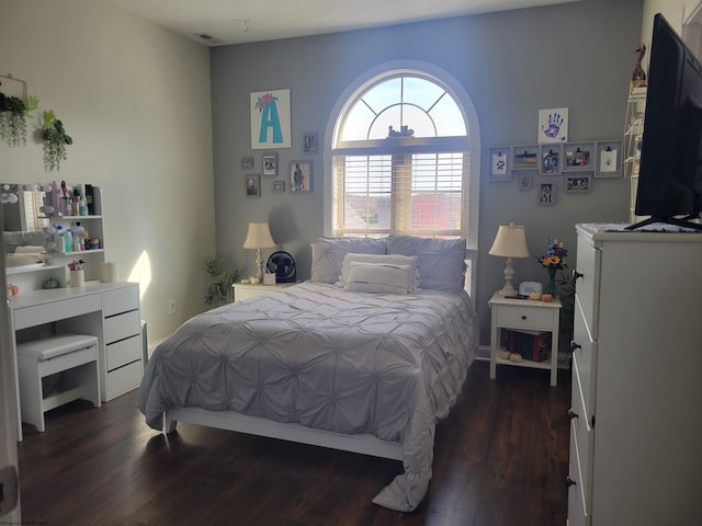 bedroom featuring dark wood-type flooring