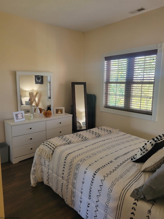 bedroom featuring dark hardwood / wood-style flooring