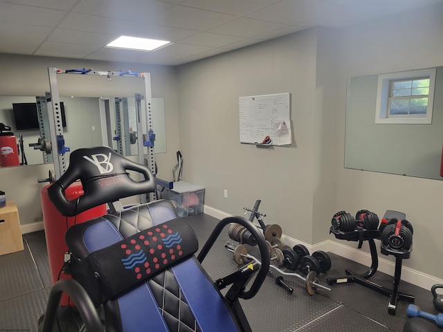 workout room with a drop ceiling