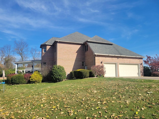 view of home's exterior featuring a lawn and a garage