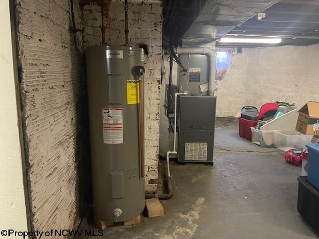 utility room with heating unit and water heater