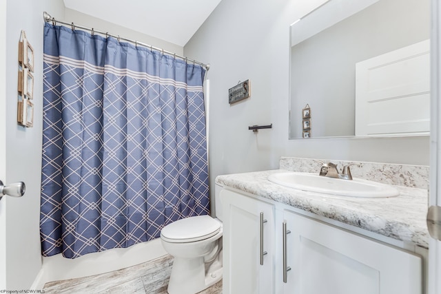 bathroom with vanity, a shower with curtain, and toilet