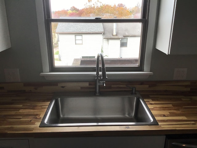 interior details with wooden counters and sink