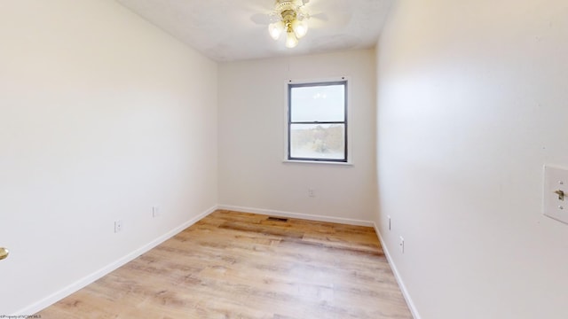 spare room with light hardwood / wood-style floors and ceiling fan