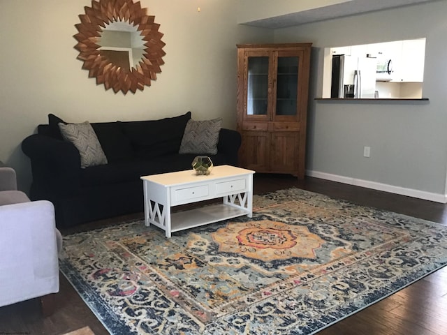 living room with dark wood-type flooring